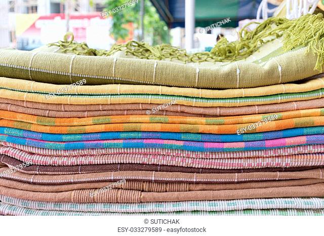 heap of cloth fabric in retail shop
