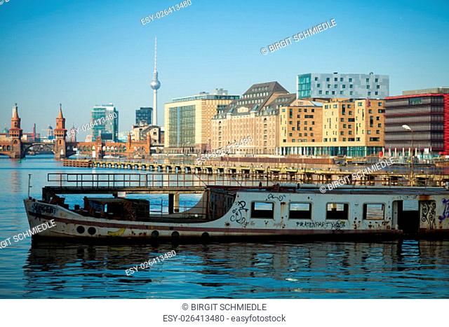 Abandoned old boat on the river Spree in Berlin, Germany