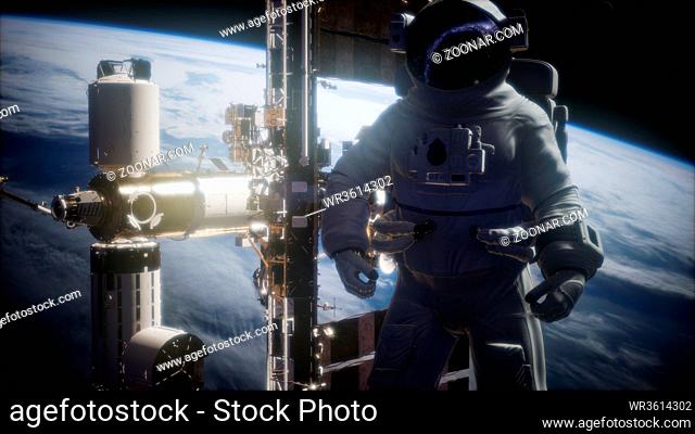 International Space Station and astronaut in outer space over the planet Earth