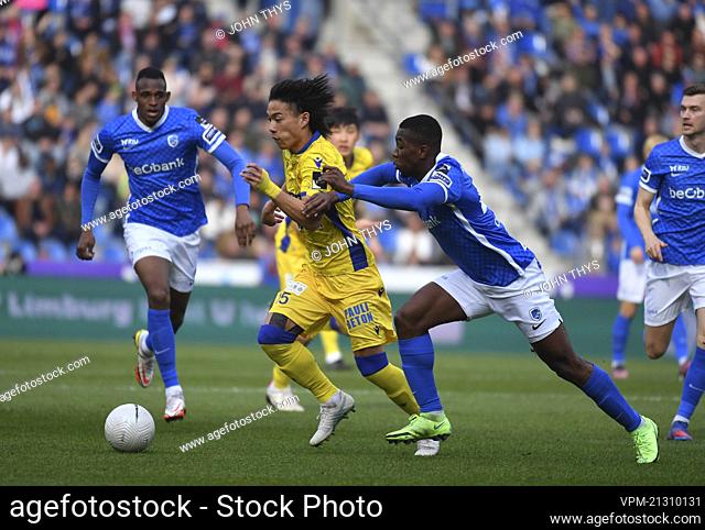 STVV's Daichi Hayashi and Genk's Carlos Cuesta fight for the ball during a soccer match between KRC Genk and Sint-Truidense VV, Sunday 13 March 2022 in Genk