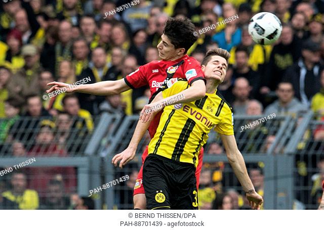 Dortmund's Julian Weigl (r) and Kai Havertz from Leverkusen at the German Bundeliga soccer match between Borussia Dortmund and Bayer Leverkusen in the Signal...