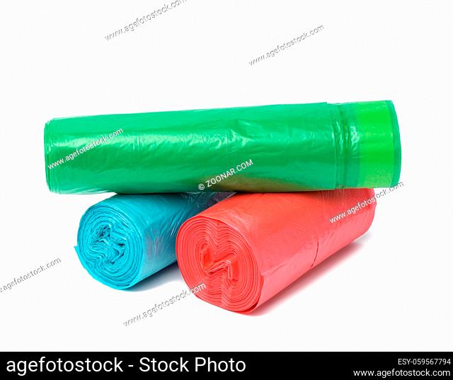 stack of polyethylene multicolored disposable trash bags on white background, close up