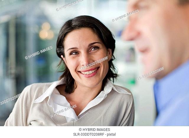Woman talking to man at cafe