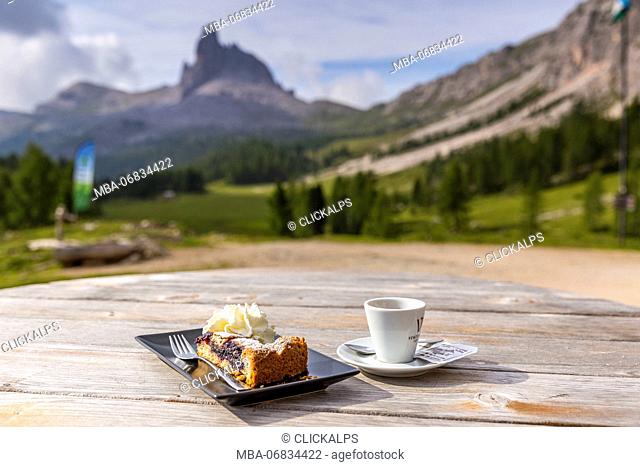 Breakfast at Croda da Lago Refuge with Mount Becco di Mezzodì in the background, Cortina d'Ampezzo, Belluno district, Veneto, Italy