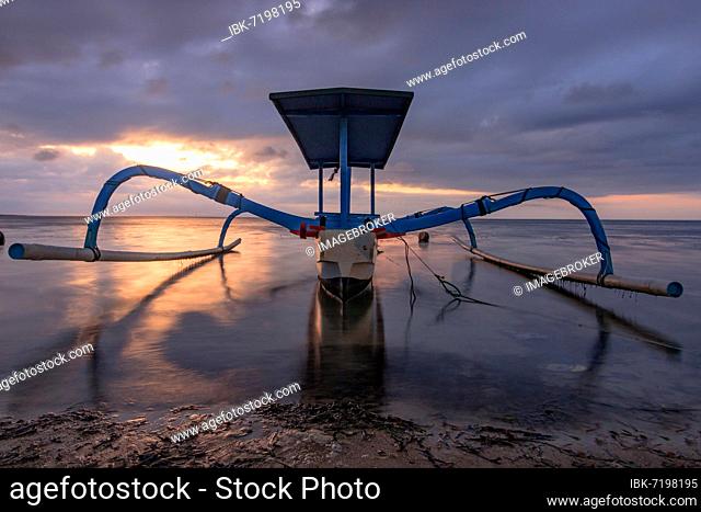 Outrigger boat, Jukung, on the beach and sunrise, Sanur Beach, Bali, Indonesia, Asia