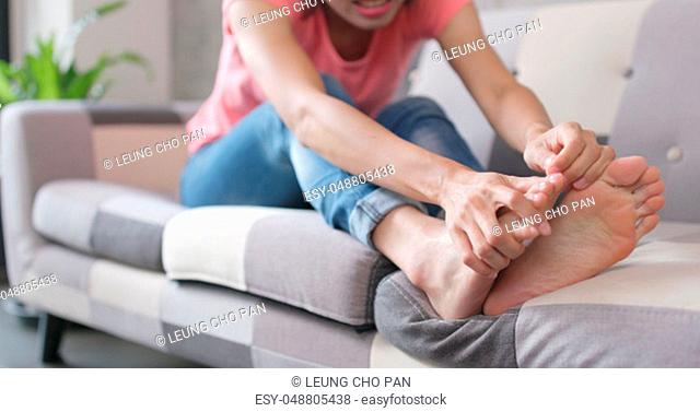 Woman feeling pain on her toe