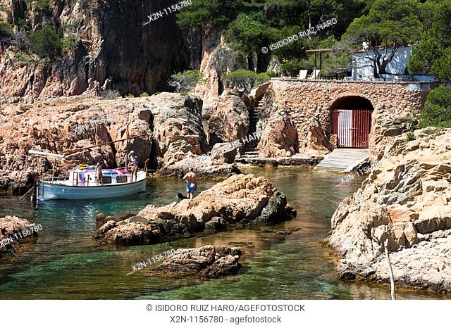 Traditional fishing boat and hut in Aigua Xelida cove Costa Brava Baix Empordà Catalunya Spain