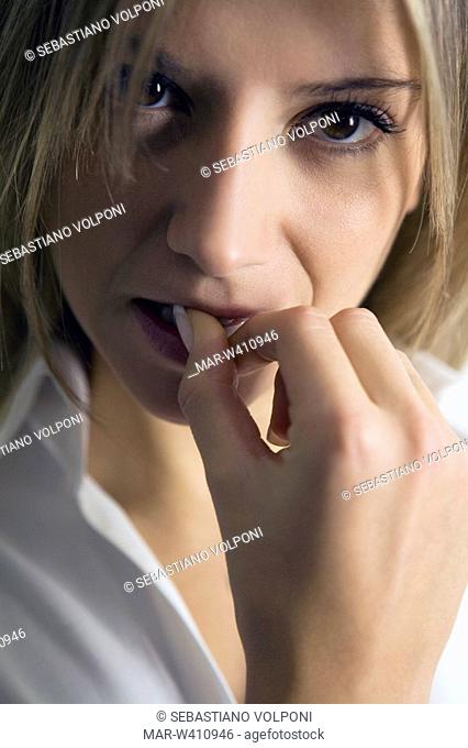 woman biting one's nails