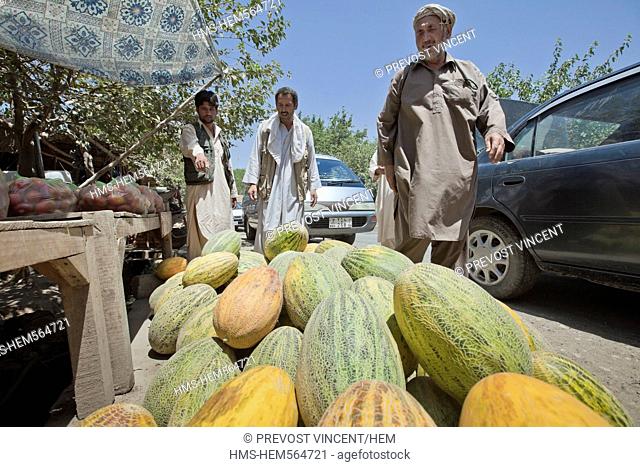 Afghanistan, Kunduz province, Aliabad, melon seller by the side of the road