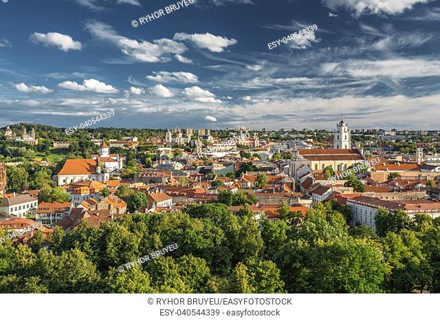 Vilnius, Lithuania. Old Town Historic Center Cityscape Under Dramatic Sky And Bright Sun In Sunny Summer Day. Travel Panorama. UNESCO World Heritage