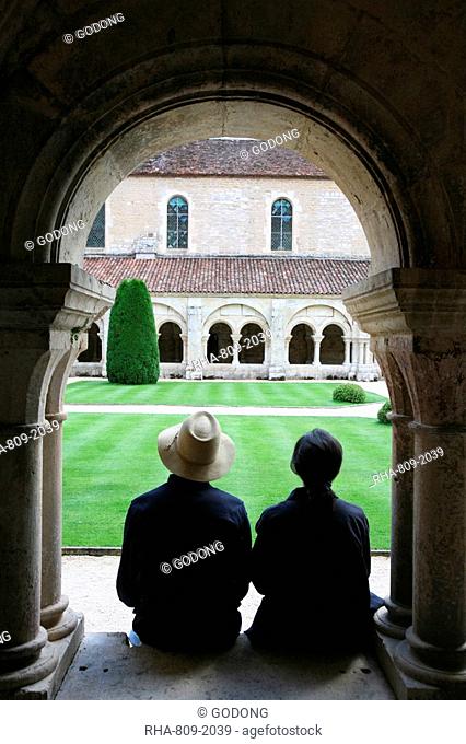 Tourists in Fontenay Cistercian Abbey cloister, UNESCO World Heritage Site, Marmagne, Doubs, Burgundy, France, Europe
