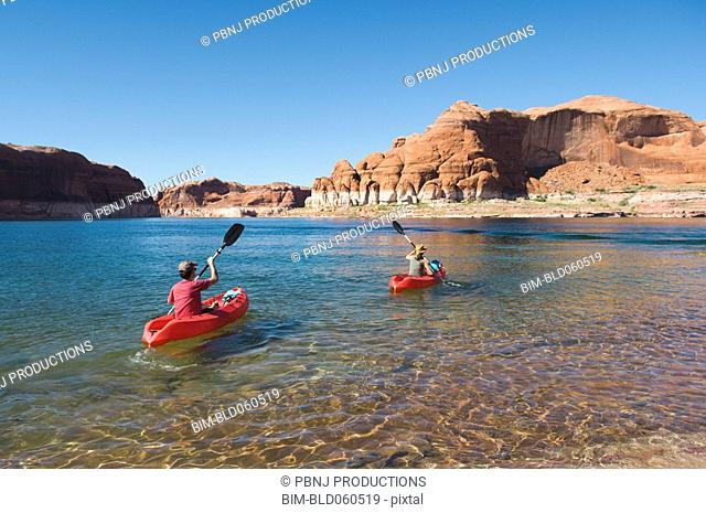 People kayaking in lake