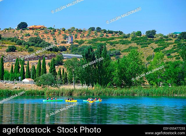 Lagunas de Ruidera, Spain - September 22, 2018: A large group of young people in different canoes having fun in the Lagunas de Ruidera