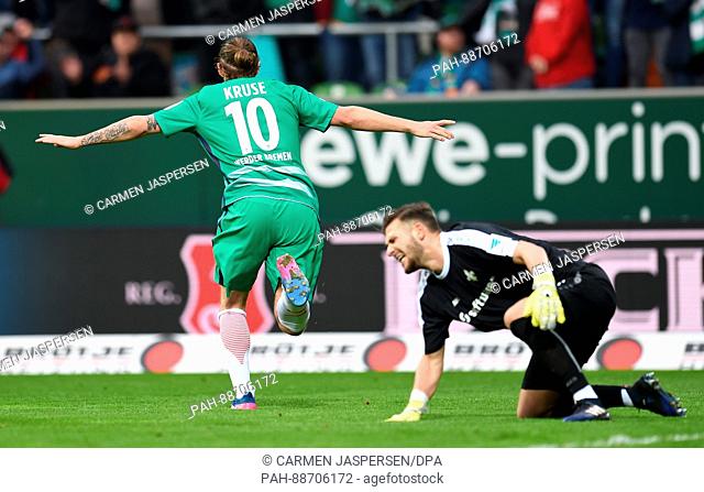 Bremen's Max Kruse celebrates after beating Darmstadt's keeper Daniel Fernandes (R) to give his side a 2:0 lead during the German Bundesliga soccer match...