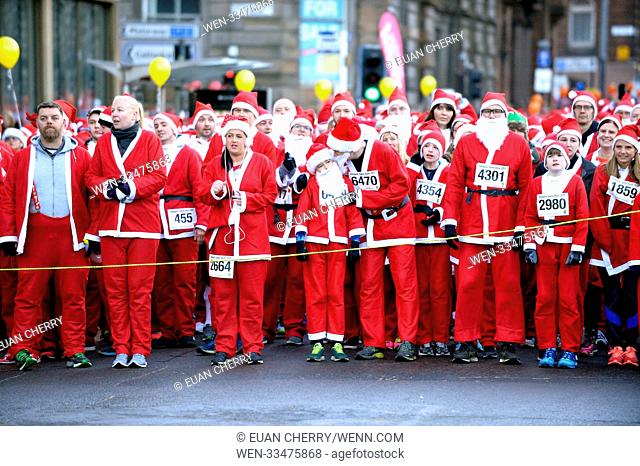 The annual Santa Dash in which 7, 500 people take to the streets in Glasgow in Santa suits for charity. Featuring: atmosphere Where: Glasgow