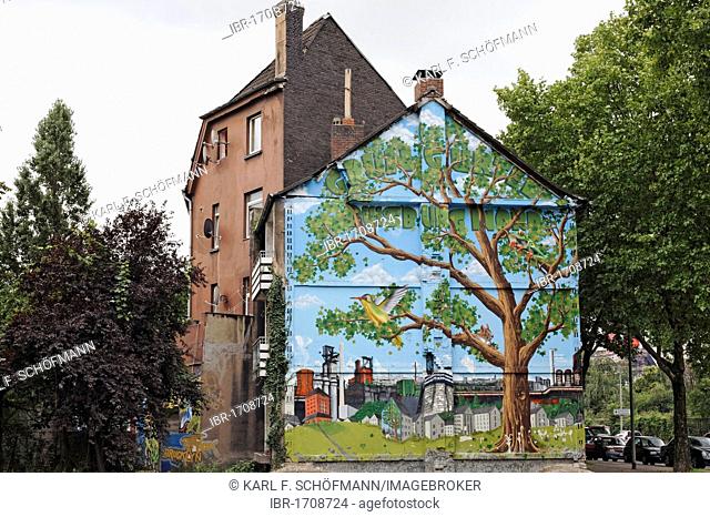 Old house about to be demolished, wall painted with a tree in an industrial landscape, Bruckhausen district, Duisburg, North Rhine-Westphalia, Germany, Europe