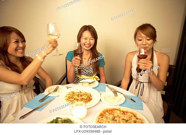 Young women eating dinner