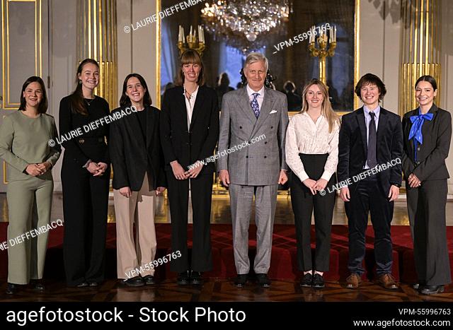 King Philippe - Filip of Belgium poses for the photographer with the winners during the award ceremony of the 2022 edition of the Belgodyssee prize for young...