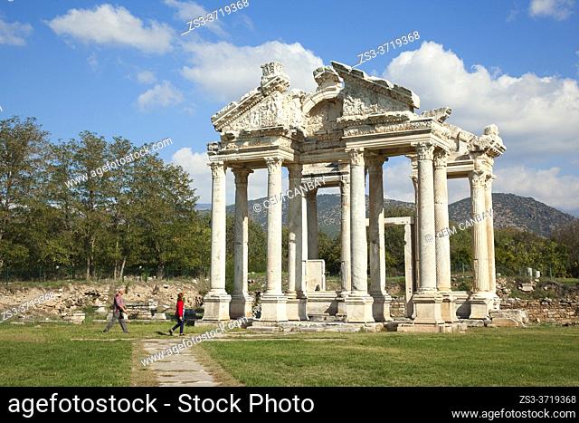 Visitors walking around the Tetrapylon at Aphrodisias Archaeological Site, Geyre, Aydin Province, Asia Minor, Turkey, Europe