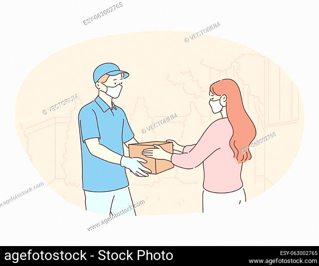 Contactless delivery, courier, online order concept. Young man courier deliveryman in protective medical mask and gloves giving order in box to woman customer