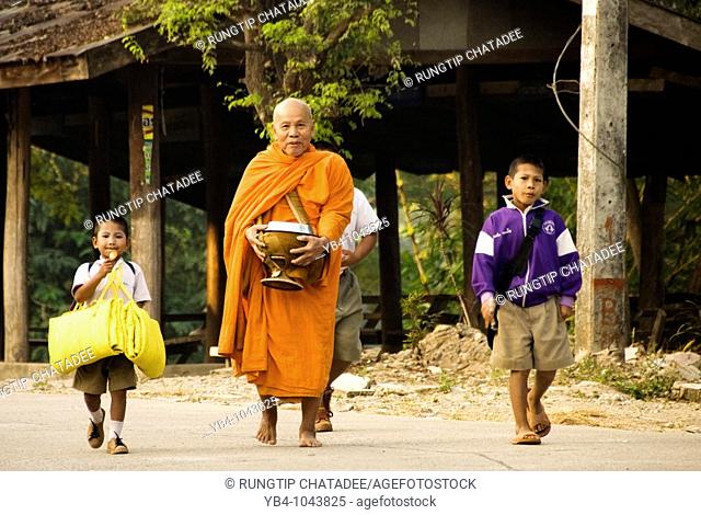 monk and school kids, mae sod, tak, thailand