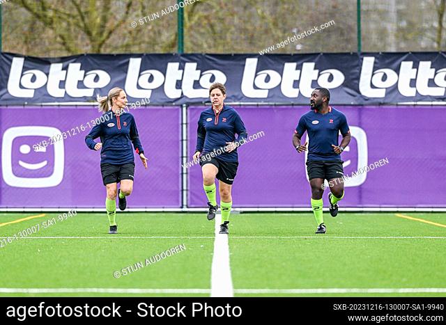 Warming-up assistant referee Melissa Lejaer , referee Sylvie Deckers and assistant referee Jerome Munana Mabruki pictured before a female soccer game between...