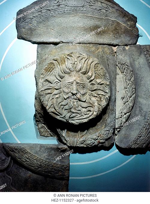 Roman carving of the Ancient British goddess Sul at Bath, England. Sul, or Sulis, was the goddess of healing waters, and had a shrine at the thermal springs at...