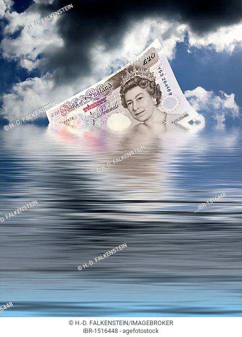 A English pound note sinking into the sea, photomontage