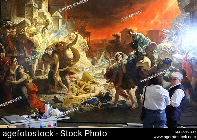 RUSSIA, ST PETERSBURG - DECEMBER 21, 2023: Women stand by Karl Bryullov's history painting The Last Day of Pompeii at a press briefing on the start of the...