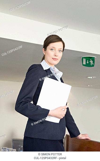 A portrait of a female receptionist