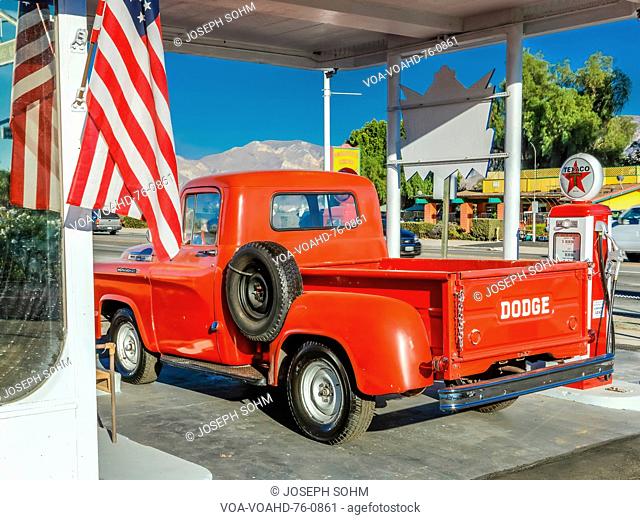 July 22, 2016 - Red Dodge Pickup truck parked in front of vintage gas station in Santa Paula, California