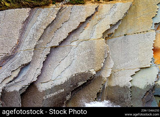 The Acantilado Flysch in Zumaia - Basque Country. Flysch is a sequence of sedimentary rock layers that progress from deep-water and turbidity flow deposits to...