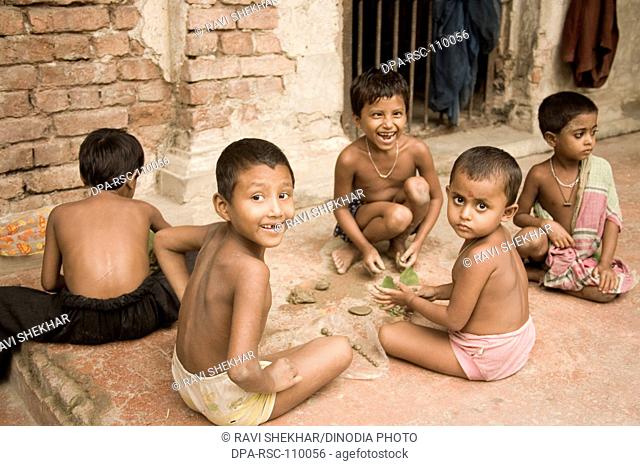 Poor naked boys playing  ; Village district Manik gunj ; Bangladesh
