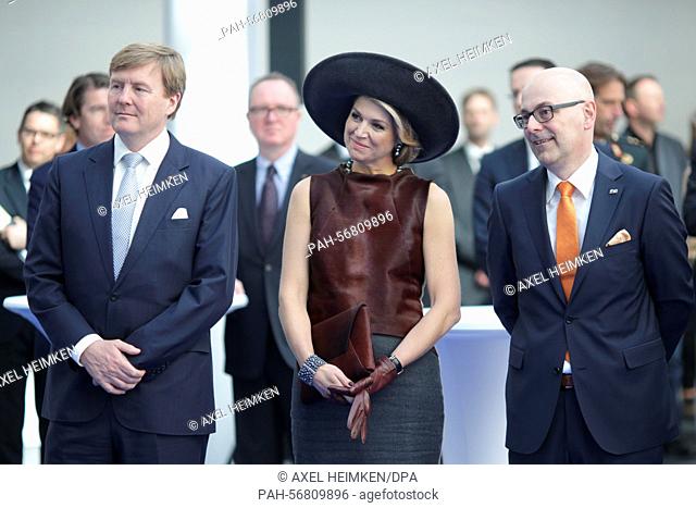 Queen Maxima and King Willem-Alexander of the Netherlands (L-R) along with State Premier of Schleswig-Holstein Torsten Albig at the Draeger company in Luebeck