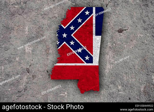 Map and flag of Mississippi on weathered concrete