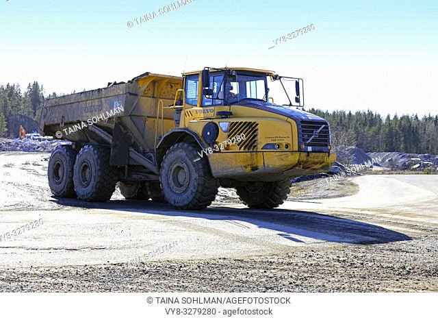Lieto, Finland - March 22, 2019: Volvo articulated hauler A35D hauls load of stone and gravel at construction site in South of Finland on a day of spring