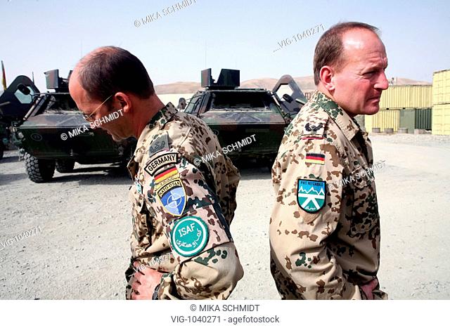The symbol of ISAF and the german flag in front of a -Fuchs- transport vehicle in Feyzabad in the north part of Afghanistan