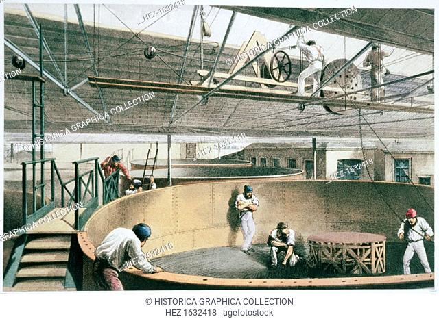 Manufacturing the transatlantic telegraph cable, c1865 (1866). Coiling the telegraph cable in the tanks at the works in Greenwich