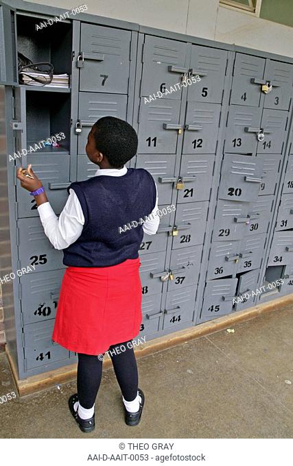 School girl by lockers, St Mark's School, Mbabane, Hhohho, Kingdom of Swaziland