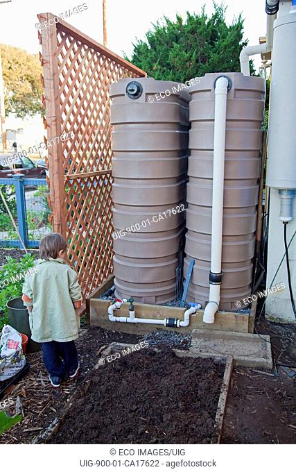 Rain barrels at the community garden at the Holy Nativity Episcopal Church in Westchester. Los Angeles, California, USA
