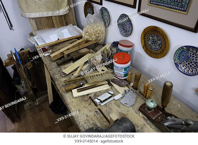 Tashkent, Uzbekistan - May 02, 2017: Close-up shot of an artist's tools inside the artist's workplace at Abul Kasim madrasa