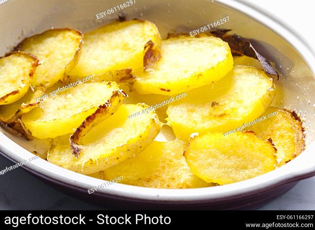 potatoes baked with grated cheese