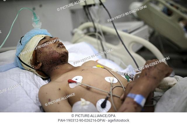 12 March 2019, Yemen, Sanaa: A Yemeni man receives treatment from wounds sustained during a reported air strike at a hospital