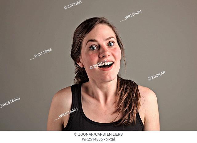 Young woman feels happy