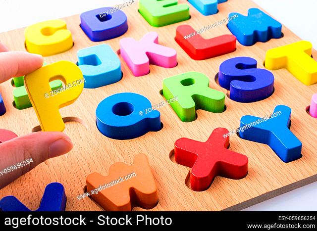 Letter P and Colorful letters on board on white background