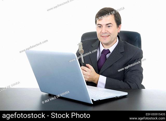 happy business man with a hammer smashing a laptop, isolated