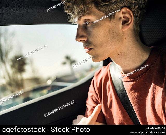 Thoughtful man sitting in car