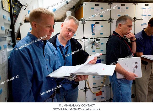 Astronauts Tim Kopra (left), STS-127 mission specialist; Doug Hurley, pilot; Dave Wolf and Tom Marshburn (partially out of frame), both mission specialists