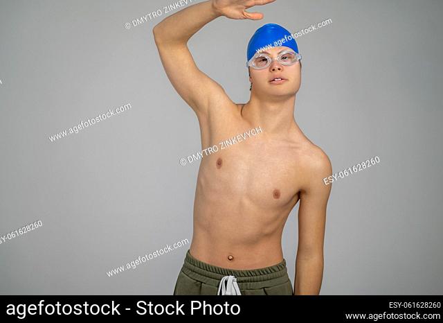 Swimmer. A boy in a swimming hat looking excited