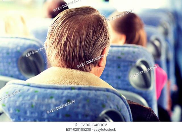 transport, tourism, road trip and people concept - close up of senior man sitting in travel bus